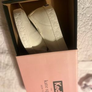Tennis shoes.  Slip on.  Brand new